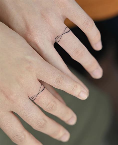 40 Best Wedding Ring Tattoos Love Symbols To Inspire You Artofit