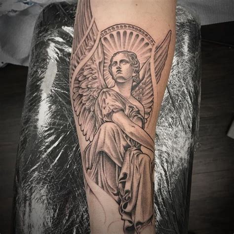 Angel Forearm Tattoos At Malik Worley Blog