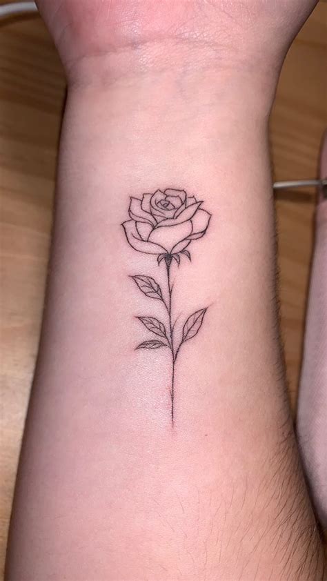 Fine Line Rose Tattoo On The Wrist