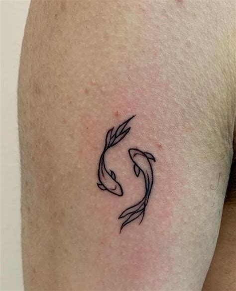 Pisces Inspired Tattoo On The Back Of The Left Arm Artofit